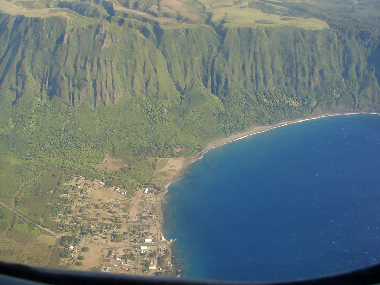 Destination view of Molokai. KalaupapaVillageCliffs